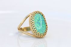 GREEN OPAL RING, Opal Gold Ring, Gemstone ring, October Birthstone, Opal Emerald lawn Gold Filled Ring, Fire Opal jewelry, Opal Big Ring Statement green opal ring made of 14k gold filled the stone is 13*18 mm , it is a perfect to give as a gift for woman Measurements: Size- available all size The center stone is 18mmx13mm Gemstone is a lab opal The ring will be packed in a gift box. FOR MY RINGS COLLECTION HERE: https://www.etsy.com/il-en/shop/rebekajewelry?section_id=14282915&ref=shopsectio Green Oval Jewelry With Bezel Setting, Green Oval Ring With Bezel Setting, Oval Green Ring With Bezel Setting, Elegant Green Opal Oval Ring, Green Opal Oval Ring In 14k Gold, Green Oval Heirloom Jewelry, Heirloom Oval Green Jewelry, Heirloom Green Oval Jewelry, Green Oval Opal Ring With Bezel Setting