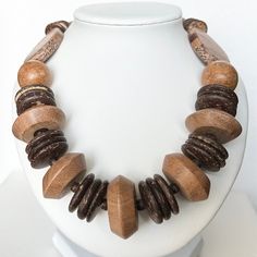 This beautiful and incredibly fun necklace has different wooden beads and coconut shells. It is an absolutely perfect and unique piece to wear while on vacation or if you're looking for something different to add to your jewelry collection! 26 inches Thank you for visiting my shop! LOVE LUCK AND BLESSINGS Handmade Brown Necklace For Vacation, Nature-inspired Brown Beaded Necklace, Unique Beaded Necklaces With Wooden Beads For Beach, Wooden Bead Necklaces For Vacation, Beaded Brown Necklace For Vacation, Brown Beaded Necklaces For Vacation, Unique Brown Necklaces For The Beach, Brown Beaded Necklace For Vacation, Unique Brown Necklace For The Beach