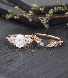 two engagement rings on top of a wooden table