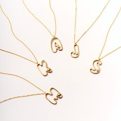 Elevate your style with our Diamond Cut-Out Initial Necklace for Women. Crafted from 14k Solid Gold, this unique cut-out initial pendant is personalized with exquisite diamonds, making it a perfect gift. Its unparalleled design and luxurious appeal enhance any outfit, making it a must-have accessory for every fashion-forward woman. This personalized diamond necklace not only adds a touch of sophistication to your look but also serves as a unique gift, perfect for any special occasion. 14K solid Bubble Letter Necklace, Diamond Initial Necklace, Bubble Letter, Solitaire Necklaces, Cross Bracelet, Personalized Bracelets, Evil Eye Necklace, Engraved Necklace, Evil Eye Bracelet