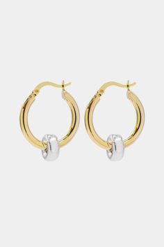 The classic gold hoop reinvented. Crafted in high polish 18K Gold vermeil with sterling silver accent, the Greyson hoops are a staple in the Hydez Essential Collection. These sophisticated head-turners will luxe up any look. Our two tone design means you’ll never have to choose between gold and silver.Materials: 18K Gold Vermeil and Sterling SilverDimensions: 20mm hoop, 3mm width What is 18K Gold Vermeil?: 3 microns of 18K Gold over Sterling Silver. Vermeil is far more durable to wear than tradi Timeless Small Hoop Huggie Earrings With Polished Finish, Silver Polished Gold-plated Hoop Earrings, Fine Jewelry Yellow Gold Sterling Silver Hoop Earrings, Timeless Hallmarked Hoop Earrings, White Gold Plated Sterling Silver Hoop Earrings, Everyday Gold Jewelry With Polished Edges, Timeless Tarnish-resistant White Gold Hoop Earrings, Timeless White Gold Tarnish Resistant Hoop Earrings, Polished Small Hoop Huggie Earrings In Yellow Gold