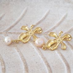 Sleek sellouts! 🤓. Order Orchid Baroque Pearl Earrings,Pearl Drop Earrings ,Vintage Style Earrings ,Pearl Jewelry, Anniversary Gift, mothers day gift at €34.00 #MinimalistEarrings #DangleEarrings #GiftForHer #VintageJewelry #BaroquePearl #titanium #PearlEarrings #PearlDropEarrings #GoldEarrings #PearlJewelry Elegant Mother's Day Pearl Earrings For Pierced Ears, Elegant Yellow Gold Flower Earrings For Mother's Day, Pearl White Drop Flower Earrings For Gifts, Feminine Pearl Earrings For Gift, Elegant Dangle Flower Earrings For Mother's Day, Handmade Gold Pearl Flower Earrings, Gold Pearl Drop Earrings For Mother's Day, Delicate Flower Pearl Earrings For Gift, Feminine Flower Pearl Earrings For Gift