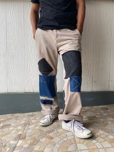 "Description: Uniqueness is here for those who love‼️ It's originally chino pants in plain khaki which 3 - 4 different tone colors of denim were patched on the front and back of the pants as photos shown. The work has completely done by both machine and hand sewing stitches in order to make it unique and perfect combination.  Photos describes the product better. So, just have a look-see at them all and read the special features below before you decide to purchase it.  Features: - Patchwork chino pants. -  3 - 4 different tone colors of denim were patched on the front and back of the pants - Frayed jeans were also used as detailing.  - Two side pockets and two rare pockets + one patched denim pocket. - Relaxed fit. - It's originally made in Maldives. Size: Waist: 34 - 35\" (Round) Hips:  40 Casual Beige Patchwork Pants, Denim Blue Cotton Patchwork Bottoms, Denim Blue Cotton Bottoms With Patchwork, Baggy Patchwork Cotton Jeans, Baggy Cotton Patchwork Jeans, Blue Patchwork Cotton Pants, Cotton Straight Leg Pants With Patchwork, Cotton Patchwork Straight Leg Pants, Patchwork Cotton Straight Leg Pants