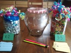 the table is set up with candy and other items to be used as gifts for someone's birthday