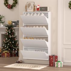 a christmas tree is in the corner of a room next to a shelf with cookies on it