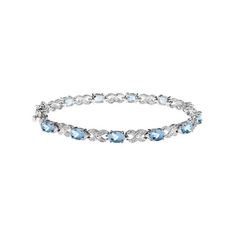 Breathtaking Blue Topaz the stone of choice in this absolutely breathtaking sterling silver bracelet that is simply too classic to be missed. Enjoy Decembers serene birthstone at a remarkable value. 5.00 Carat (ctw) Blue Topaz Bracelet in Sterling Silver Size: One Size.  Gender: female.  Age Group: adult. Formal Blue Topaz Bracelet, Fine Jewelry Silver Bracelet With Blue Topaz, Elegant Sterling Silver Bracelet With Blue Topaz For Gifts, Elegant Sterling Silver Bracelet With Blue Topaz, Elegant Sterling Silver Blue Topaz Bracelet Gift, Blue Topaz Bracelet, Womens Bracelets, Sterling Silver Bracelets, Blue Topaz