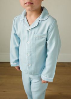 Little English Classic Pajama Sets are back for Fall! With long sleeves, long legs, and a soft, flannel-y feel, these pajamas are sure to be a favorite this season! They run from 18m - 12, making them perfect for sibling matching & sister can coordinate in our Classic Nightgown - Light Blue. 100% fire-resistant polyester Machine wash cold, tumble dry low Button closures down front, elastic waistband Light Blue Cotton Long Sleeve Sets, Light Blue Long Sleeve Cotton Sleepwear, Long Sleeve Bedtime Sets For Fall, Blue Long Sleeve Loungewear Set, Fall Bedtime Sets With Long Sleeves, Blue Long Sleeve Sleep Sets, Blue Long Sleeve Sleepwear For Lounging, Blue Long Sleeve Tops For Sleepover, Blue Long Pants Sleepover Sets