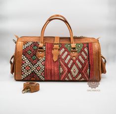 "Are you looking for a dependable and trendy duffel bag that is easy to carry and spacious? For travel lovers who appreciate the craftsmanship and hard work that goes into handmade patterns, this Kilim duffel bag is a must have! With the creative hand-woven Kilim patterns, and high-quality material, we bring to you a duffel bag that is unique and lightweight. Made from premium quality durable leather, our duffel bags are built to last longer than time itself. This duffel bag is no ordinary bag! Traditional Rectangular Duffle Bag For Travel, Bohemian Duffle Bag With Leather Handles For Daily Use, Bohemian Rectangular Duffle Bag With Leather Handles, Bohemian Rectangular Bag With Luggage Sleeve, Bohemian Leather Tote Duffle Bag, Bohemian Satchel Duffle Bag For Trips, Bohemian Brown Satchel Travel Bag, Bohemian Duffle Bag With Large Capacity For Trips, Bohemian Brown Duffle Bag With Leather Handles