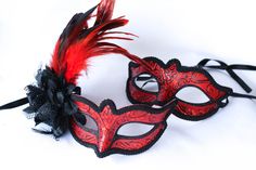 This are two matching beautiful masquerade phantom red and black masquerade masks. matching to his is a hers phantom masquerade mask added a girly and elegant touch to it with a black flower and gorgeous red feathers. I can do both on a stick or one if you wish. If you decide to have the masks on a stick please feel free to contact me anytime! I can make a custom order for you and this will not interfere with the processing and shipping the mask! Please take a look at my shop I have other masque Red Eye Mask For Masquerade, Red Venetian Masquerade Mask For Party, Venetian Red Masquerade Mask For Party, Red Masks And Prosthetics For Mardi Gras Masquerade, Red Eye Mask For Carnival, Red Masquerade Mask For Mardi Gras, Red Masquerade Mask For Mardi Gras Party, Red Theater Mask For Mardi Gras, Red Theater Masks For Mardi Gras