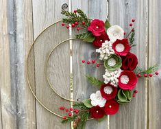 This stunning wreath would look fantastic on your door this holiday season! This wreath features a gold wreath base full of Christmas felt handmade blooms with berries and greenery! It's bigger measuring at 16 inches! Love this wreath but with different colors?  I have tons to choose from simply send me a convo! Would make a great birthday, Christmas, Mother's Day, new home, baby, bridal shower or wedding gift! Made in a smoke and pet free home! Love this wreath but want it a bit different?  I c Christmas Wreaths Felt, Christmas Felt Wreath, Felt Christmas Wreath, Felt Wreaths, Christmas Tree Base, Felt Flower Wreaths, Wreath Frames, Felt Flowers Diy, Christmas Decorations Cheap