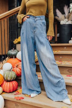 - These wide legged pants are a trendy option to add to your wardrobe! - Unlined chambray material - A waistline with an elastic back, belt loops, a hidden zip fly, and button closure - A functional five pocket cut - Pleated detail - An ultra relaxed silhouette that end in floor length frayed hemlines Trendy Faded Pants For Fall, Medium Wash Washed Pants For Fall, Fall Washed Denim Blue Pants, Wide-leg Denim Jeans For Fall, Fall Washed Blue Pants, Medium Wash Wide Leg Pants For Fall, Dark Wash Denim Wide Leg Pants For Fall, Light Wash Wide-leg Jeans For Fall, Fall Light Wash Denim Wide Leg Pants