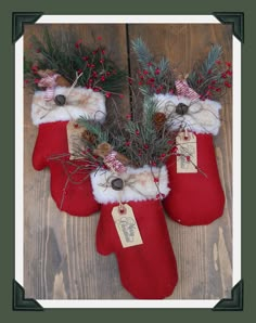 three stockings with christmas decorations hanging from them