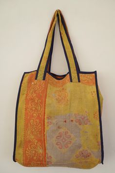 This bag is made from a vintage hand-stitched Kantha quilt. We make only 1-2 bags from each quilt and every one of them is one of a kind! Details: Shell fabric- Vintage Quilted Cotton Kantha 1. width (cm) - 40 2. height (cm)- 45 3. depth (cm) - 45 4. weight (g)- 0.400 kg 5. length of the shoulder (cm) -40 cm Care instructions: Dry clean or Hand-wash in warm water. Drip dry. How it's made: Kantha quilts are made using numerous layers of recycled silk or cotton saris which are hand-stitched in the Vintage Square Bag For Daily Use, Vintage Yellow Bag For Everyday Use, Vintage Yellow Bag For Everyday, Vintage Yellow Bag With Removable Pouch, Vintage Yellow Shoulder Bag For Daily Use, Vintage Orange Rectangular Shoulder Bag, Yellow Vintage Shoulder Bag For Shopping, Vintage Yellow Tote Shoulder Bag, Vintage Yellow Pouch Bag