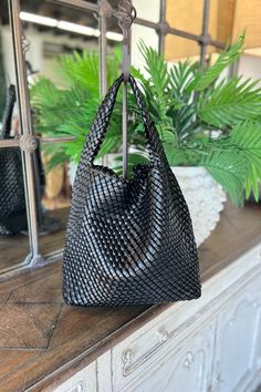 Carly Bag Black Handbags Atlanta/Susie On-the-go Woven Leather Pouch Shoulder Bag, Black Woven Leather Hobo Bag For On-the-go, Woven Leather Bucket Shoulder Bag For Shopping, Bucket Pouch Bag With Braided Handles For Errands, Woven Leather Shoulder Bucket Bag For Shopping, Hobo Bag With Braided Handles, Pouch Satchel With Braided Handles For Shopping, Black Rectangular Hobo Bag With Braided Handles, Everyday Woven Leather Pouch Shoulder Bag