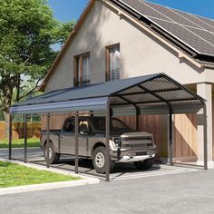 a truck is parked in front of a house with a solar panel on the roof