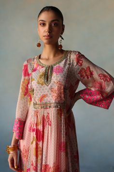 Pink flower vine print front puckering crepe kurta with intricate embroidery on yoke and cuffs. Paired with hot pink modal palazzo with applique dori embroidery and pink organza dupatta with dori work.
Components: 3
Pattern: Print
Type Of Work: Flower Vine
Neckline: Round Neck
Sleeve Type: Three Quarter Sleeves
Fabric: Crepe, Modal Satin, Organza
Color: Pink
Other Details: 
Anarkali
Cutdana and sequin embroidered yoke
Pant:
Scallop trim hemline with embroidery
Dupatta:
Tassel detailing
Scallop t Needle And Thread Dresses, Lehenga Blouse Designs, Fancy Kurti, Pakistani Formal Dresses, Long Kurti Designs, Classy Outfits For Women, Dress Design Patterns, Kurta Designs Women, Lakme Fashion Week