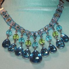 Nwtags: Aqua Blue Teardrop Necklace, Has Lime Green Beads And Rhinestones Around The Top, 18" Chain, 3" Teardrops In The Middle, Has A Row Of Round Small Rhinestones Up On The Top Of The Necklace, Blue Jeweled Necklace For Party, Blue Crystal Beaded Necklaces For Party, Blue Crystal Beaded Necklace For Party, Elegant Blue Beaded Necklaces With Gemstone Accents, Elegant Blue Beaded Necklace With Gemstone Accents, Elegant Blue Crystal Necklace With Gemstone Accents, Blue Teardrop Drop Necklace For Party, Blue Crystal Necklace For Party, Blue Jeweled Rhinestone Costume Necklace