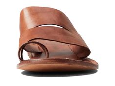 Featuring wide straps on the upper, the Free People™ Abilene Top Loop Sandal offers a unique look..Leather upper, lining, and insole..Slide-on style with toe loops..Open round toe..Flat silhouette..Cushioned footbed with branding detail..Leather outsole..Imported..Product measurements were taken using size EU 39 (US Women's 9), width M. Please note that measurements may vary by size..Measurements: Heel Height: 3/4 in Weight: 7 oz Summer Slides With Branded Insole And Single Toe Strap, Summer Leather Mules With Rubber Sole, Chic Brown Slides With Leather Footbed, Casual Mules With Heel Loop For Summer, Casual Summer Mules With Heel Loop, Summer Slide Mules With Leather Sole, Summer Mules With Rubber Sole And Single Toe Strap, Summer Slides With Rubber Sole And Single Toe Strap, Brown Double Strap Slides For Summer