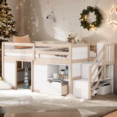 a child's bedroom with a bunk bed, stairs and christmas tree in the corner