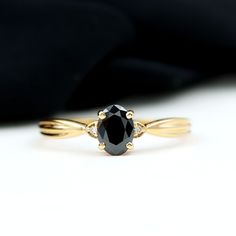 Product Details Immerse yourself in the captivating beauty of this Solitaire Ring, a true masterpiece of craftsmanship. The 6X8 MM Oval Shape Black Onyx gemstone is set in Prong Setting with a Diamond on either side over the Pinched Shank. Symbolizing the eternal nature of your love, this Black Onyx Ring is a timeless expression of your commitment. Product Information SKU SHP-RINGS0821185214 Width 3.8 mm Height 7 mm Weight 2.40 gm (Approximate) BLACK ONYX INFORMATION No.of Stones 1 Pieces Total Oval Stone Rings, Black Stone Engagement Ring, Senior Ring, Black Gemstone Ring, Black Sapphire Ring, Crazy Lady, Black Diamond Engagement Ring, Black Onyx Engagement Ring, December Birthstone Ring