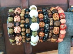 WE HAVE A TON OF OTHER WOOD BEAD BRACELETS!  CLICK BELOW TO SEE ALL STYLES. https://www.etsy.com/shop/BeautifulByTheBauers?ref=shop-header-name&listing_id=1563599230&section_id=44879093 Check out the rest of our Etsy shop : ) One size fits most adults and big kiddos. Worried about needing needing a smaller or bigger size? Just send me a message! Discover the essence of Bohemian elegance with our Handmade Boho Style Wood Bead Bracelets. Crafted with care and creativity, each of these bracelets is Cheap Colorful Beaded Brown Jewelry, Cheap Wooden Beaded Bracelets For Meditation, Cheap Artsy Jewelry With Round Beads, Traditional Beaded Bracelets At Cheap Price, Cheap Vintage Beaded Bracelets For Festival, Affordable Traditional Beaded Bracelets For Festivals, Luxury Multicolor Wooden Beads Jewelry, Affordable Brown Jewelry With Colorful Beads, Cheap Hippie Style Bracelet