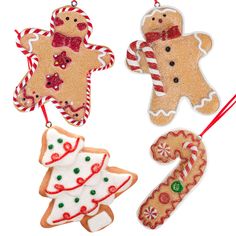 three christmas ornaments are hanging from strings on a white background, one is decorated with gingers and the other has candy canes