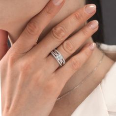 a close up of a person wearing a ring