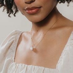 P E A R L ∙ N E C K L A C E  Gift your bridesmaids something they can wear every day and any day. The pearl pendant on a dainty station chain is elegant and delicate, everything you want in a beautiful bridal or bridesmaid jewelry piece. * Material: High Quality Solid 925 Sterling Silver, Freshwater Pearl.  * Finish: Sterling Silver ∙ 18K Gold * Featuring ~12mm Pearl pendant with an adjustable 16 to 18 inch Station style chain. Model is wearing the 18 inch length in the first listing image. H O Wedding Charm Necklace With Delicate 14k Gold Filled Chain, Delicate Chain 14k Gold Filled Charm Necklace For Wedding, Minimalist Teardrop Jewelry For Weddings, Delicate Bridal Necklace As Gift, Delicate Gold Necklace For Bridesmaids, Minimalist Teardrop Wedding Jewelry, Delicate Bridal Necklace For Gift, Delicate Clavicle Chain Necklace For Bridesmaid Gift, Feminine Wedding Necklace With Clavicle Chain