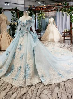 If you are looking for a perfect and long lace for your marriage, this mind-blowing ball gown with a scoop neckline is perfect for you. Some well-fitted hand made flowers are added across the neckline along with the long Sleeve that is also added to it. The back of the gown is also well decorated with a premium lace-up back style and a small opening that is also added to bring out the beauty of the gown. The skirt of the gown has a design that is spread across part of it. It has some flapping design that is also attached to the waist of the wedding dress. Ball Gowns Fantasy, Blue Ball Gown, Women Robe, Blue Ball Gowns, 파티 드레스, Blue Ball, Princess Ball Gowns, Backless Wedding, Wedding Dresses Beaded