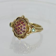 Very Unique Victorian HAND MADE 14K Gold Ring 19 RUBY + 2 EMERALD Measurement : Size: Custom / Adjustable WIDTH : 1.5 CENTIMETER WEIGHT : 5.7 GRAM FREE SHIPPING EXPRESS MAIL Gold Multi-stone Ruby Birthstone Ring, Gold Ruby Ring With Accent Stones, Heirloom Ruby Ring With Accent Stones In Yellow Gold, Heirloom Yellow Gold Ruby Ring With Accent Stones, Gold Multi-stone Ruby Promise Ring, Antique 14k Gold Ruby Ring With Multi-stone, Fine Gold Multi-stone Ruby Ring, Gold Ruby Ring With Multi-stone, Gold Ruby Ring With Multi-stone Detail