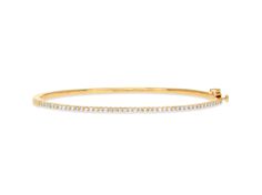 This gorgeous pave oval bangle is available in 14k yellow, white and rose gold with a double clasp closure. This piece looks great alone, and even better stacked. This is the perfect classic diamond bangle- a piece that will never go out of style. A great gift to enjoy for years to come. Perfect gift for anniversaries and push presents. Can be special ordered in rose gold. Average carat weight 0.50 cts The size of this bangle bracelet is approximately 6.3 inches for a size small wrist. This represents the inside circumference the bangle. Please contact us for custom sizes. Classic Diamond Pave Bangle Bracelet, Classic Gold Bangle Bracelet With Pave Setting, Classic Oval Bangle With Diamond Accents, Elegant Oval Bangle With Single Cut Diamonds, Classic Yellow Gold Bangle With Pave Setting, Oval Bangle With Diamond Accents In Fine Jewelry Style, Oval Diamond Bangle With Single Cut Diamonds, Oval Bangle With Single Cut Diamonds, Oval Bangle