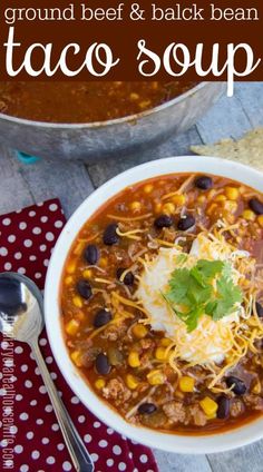 a white bowl filled with taco soup on top of a table