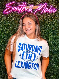 Enjoy Saturdays in Lexington with this stylishly comfortable t-shirt. Celebrate your football pride with a short sleeve tee perfect for game days or everyday wear. Show your spirit and go big blue with this must-have piece! What's not to love? Unisex sizing and fit Game Day T-shirt With Screen Print For Sports Season, Football Season Fan Apparel T-shirt With Screen Print, Pre-shrunk Sports Fan T-shirt For Game Day, Pre-shrunk T-shirt For Football Season With School Spirit, White T-shirt For Game Day Football Season, Game Day Team Spirit T-shirt With Screen Print, Football Season Sports Fan T-shirt With Screen Print, White T-shirt For Football Season Game Day, Sports Fan T-shirt For Football Season With Screen Print