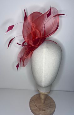 Complete your look with a beautiful crinoline fascinator! This stunning accessory features a 10.5cm diameter sinamay base with coordinating feathers and a headband for a comfortable fit. It's available in a variety of colors to complement any outfit. 🖤Shipped in a sturdy (keepsake) box and packed with special love and care.  🖤Made in the UK - customised fascinator orders are welcome. Please send me a message and we can create something unique.  Terms & Conditions I hope you love your purchase however I gladly accept returns, exchanges and cancellations. Head pieces must be returned within 14 days with all tags attached for a full refund. Cancellation must be made within 2 days of purchase.  🖤Finally I would love to share in your special day so please tag or send me pictures of you looki Luxury Red Fascinator For Formal Occasions, Fitted Bridal Accessories For Royal Ascot Party, Fitted Bridal Accessories For Kentucky Derby Party, Red Hair Accessories For Wedding And Kentucky Derby, Red Adjustable Hair Accessories For Wedding, Adjustable Fascinator For Royal Ascot Wedding, Adjustable Fascinator For Wedding At Royal Ascot, Red Wedding Fascinator, Fitted Fascinator For Kentucky Derby Ceremony