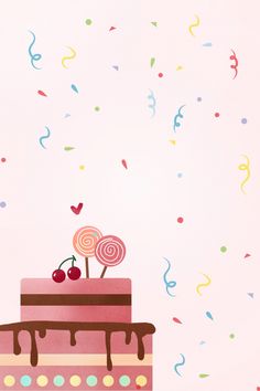 a cake with two lollipops on top and confetti around it