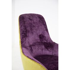 a purple and yellow chair sitting on top of a white floor