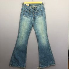 Vintage 90s Big John Flare Bush Pants Crazy Bootcut Jeans - GF30017.  Manual Measurement (laying in flat area):  1) Waist: 28 inch.  2) Rise: 10 inch.  3) Hips: 17.5 inch.  4) Tight: 10.5 inch.  5) Outseam: 42.5 inch.  6) Inseam: 33.5 inch.  7) Leg opening: 11.5 inch.  Made in: JAPAN.  Fabric Material: 100% Denim Cotton.  Condition: In good vintage condition overall.  Please check all the measurement to insyre a proper fit.  Remember to allow yourself some extra room for movement.  You can compa 90s Style High Waist Denim Blue Flare Jeans, Denim Bottoms With Buttons For Streetwear, 90s Style Cotton Flare Jeans With Pockets, 90s Style Dark Wash Wide Leg Pants, 90s Wide Leg Flare Jeans With Five Pockets, Retro Mid-rise Jeans With Pockets, 90s Style Wide Leg Dark Wash Pants, Light Wash High Rise Grunge Bottoms, Retro Flare Jeans For Streetwear