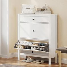 a white shoe rack in the corner of a room