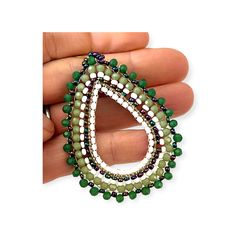 These handmade, green beaded hoop earrings are perfect for anytime. The richly hued shades bring out the color of any outfit. The effect is a concentration of color and interest, sure to turn heads. The earrings come in an array of greens from rich deep forest to light celery complimented by white and iridescent beads for an unusual pattern. The dark green frames the outer side of the tear shaped hoop transitioning to the lighter green, followed by the white with the inner part of the hoop which in turn is framed by the iridescent beads. One of the original artists we discovered created these beautiful statement earrings. He is from a family of talented artists. While we love his talent and the beautiful, creative pieces he makes its - it is his beaming smile and the obvious joy in what he Horn Bracelet, Celery Green, Deep Forest Green, Horn Earrings, Multicolor Jewelry, Tiger Eye Jewelry, Horn Jewelry, Lapis Lazuli Jewelry, Carnelian Jewelry