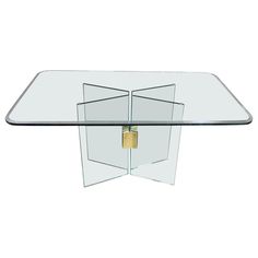 a glass and metal table with an open door on the top, against a white background