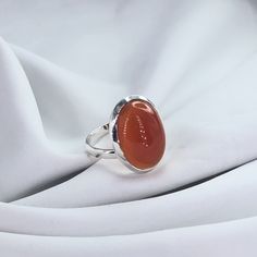 Carnelian Ring, Gemstone Ring, Oval Shape Carnelian Ring, Modern, Simple, Everyday, Gift, Gemstone Jewelry, Natural Stone, Stacking Ring Stone Name: Carnelian Primary Color : Silver Material : 925 Sterling Silver Shape: As Photo Stone Color: Red Explore our exquisite collection of handcrafted gemstone solid silver jewelry on Etsy. Each piece is meticulously designed and expertly crafted, ensuring a unique and timeless beauty. Our jewelry is made with genuine, high-quality gemstones set in solid Oval Agate Crystal Ring With Gemstone, Oval Agate Gemstone Crystal Ring, Oval Carnelian Wedding Rings, Oval Agate Ruby Ring For Anniversary, Oval Cabochon Agate Ring For Anniversary, Oval Natural Stone Rings For Anniversary, Classic Orange Oval Cabochon Rings, Oval Rings With Natural Stones For Anniversary, Anniversary Agate Rings With Polished Finish