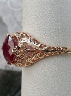 natural red ruby solitaire ring with swirl antique floral rose gold filigree Classic 14k Rose Gold Ruby Ring For Anniversary, Elegant Yellow Gold Ruby Ring With Intricate Design, Victorian Rose Gold Ruby Ring, Elegant 14k Gold Ruby Ring With Intricate Design, Classic Rose Gold Ruby Ring For Anniversary, Victorian 14k Gold Ruby Ring With Intricate Design, Classic Rose Gold Rings With Intricate Design, Elegant Rose Gold Ruby Ring With Rose Cut Diamonds, Rose Gold Rings With Intricate Design