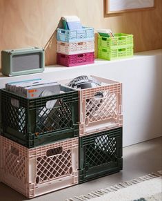 three crates are stacked next to each other on the floor