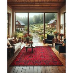 a living room filled with furniture and a large red rug on top of a wooden floor