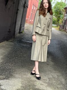 "Beautiful tailored vintage Bavarian style women's suit jacket and skirt suit set-shades of green with attention to the details. Jacket pockets. Beautiful lining.  Marked 38 Measures  Jacket  Bust 36\" Waist 32\"  Length 22\" Shoulder 15\" Sleeve 22\" Skirt Waist 28\" Hip 36\" Length 28\" Excellent condition with no flaws to note.  Please message me with questions before purchasing. All sales are final and ship quickly from our Vermont shop.  Instagram @ anasclosetfullofcolor  Facebook @ anastasiastarcloset  Thank you" Tailored Fall Skirt Suit With Pockets, Tailored Fall Skirt Suit With Buttons, Fitted Skirt Suit With Pockets For Fall, Classic Fitted Green Skirt Suit, Classic Green Fitted Skirt Suit, Retro Fitted Skirt Suit For Spring, Fitted Fall Skirt Suit With Button Closure, Fitted Skirt Suit With Button Closure For Fall, Spring Formal Skirt Suit With Pockets