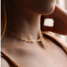 Our newest Chain Link Choker features larger links for a bold and modern statement. MEASUREMENTSAvailable in 14k gold fill or sterling silverChoker length is 14" with an adjustable 1" extender chain and lobster clasp. Also offered in a 16" length for a longer length. Minimalist 14k Gold Filled Paperclip Chain Jewelry, Modern 14k Gold Filled Jewelry With Adjustable Chain, Modern Gold-plated Jewelry With Paperclip Chain, Modern 14k Gold-filled Jewelry With Adjustable Chain, Chic Gold Paperclip Jewelry, Modern Gold Jewelry With Paperclip Chain, Minimalist Chunky Chain Oval Link Jewelry, Minimalist Chunky Chain Jewelry With Oval Links, Modern 14k Gold Filled Link Jewelry