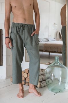 "Culottes linen pants for men to fill a gap in their everyday wear. They are breathable and durable to provide maximum comfort for wearing them on yoga exercise or just like loungewear.. The lounge style is redefined with straight-leg drop and cropped length. They have two side pockets and the drawstring closure. Elastic band on the waist and drawstrings makes the pants feel comfortable and stylish in everyday wear. Available in various colors and free to experiment with different styles and the Relaxed Trousers With Pockets, Relaxed Green Bottoms With Pockets, Summer Cropped Leg Pants With Pockets, Summer Loungewear Cargo Pants, Summer Tapered Leg Cargo Pants For Loungewear, Summer Tapered Leg Cargo Lounge Pants, Summer Ankle-length Cargo Pants For Loungewear, Summer Ankle-length Linen Cargo Pants, Casual Cropped Harem Pants With Pockets