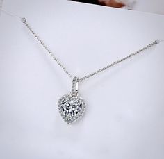 Delicate and elegant, this heart necklace will add a touch of sophistication to any wedding gown or formal ensemble. Adorned with heart-shaped cubic zirconia that captures the light from every angle with a perfectly translucent appeal, the necklace is rhodium / rose gold plated for a flawless finish which perfectly enhances the intricate detailing and conveys a modern take on old elegance. Length: 16" (approx. 40.6cm) with a 2" (approx. 5cm) extension for comfortable sizing. Available in Silver Bridal Necklace, Matching Bracelets, Heart Jewelry, Necklace Silver, Wedding Gown, Matching Earrings, Rose Gold Plates, Heart Necklace, Silver Necklaces