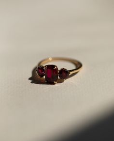 Red Ruby Diamond Ring, Three Stone Gemstone Ring, Elongated Cushion & Round Cut Engagement Ring, Past Present Future Wedding Ring, 14K Gold Item Description: Stone - Simulant Diamond Stone Shape - Elongated Cushion & Round Cut 1. White Gold: 10K/14K/18K 2. Yellow Gold: 10K/14K/18K 3. Rose Gold: 10K/14K/18K 4. Silver: Sterling Silver 925 Size Customization: What Size you want... * You can also Customize ring size in US 4 to US 12! It sometimes affects to price. * Main Stone & Shape Customization: Ruby 3 Stone 18k Gold Ring, Antique Ring Round Stone, Non Diamond Engagement Rings Catbird, Engagement Ring With Small Ruby, Solid Gold Rings With Stone, Minimalist Luxury Ruby Ring For Anniversary, Ruby Ring Vintage Eragem, Big Stone Rings Simple, Luxury Heirloom Garnet Rings