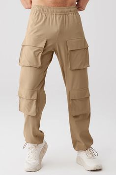 Cargo Venture Pant - Gravel | Alo Yoga Alo Yoga Solid Color Pants With Pockets, Alo Yoga Solid Pants With Pockets, Athleisure Nylon Pants With Pockets, Nylon Athleisure Pants With Pockets, Sporty Alo Yoga Pants With Pockets, Sporty Cargo Pants With Functional Drawstring, Relaxed Fit Cargo Pants With Functional Drawstring For Sports, Utility Nylon Pants With Functional Drawstring, Sports Full Length Cargo Pants With Side Pockets